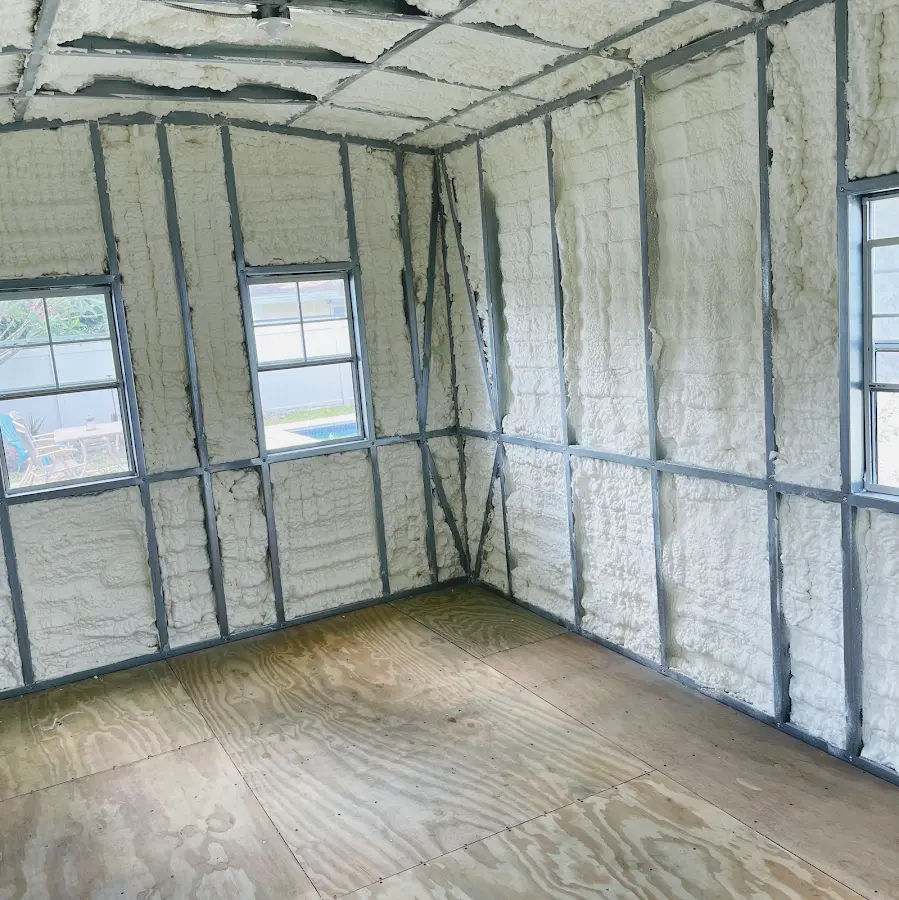 Closed-cell spray foam insulation applied to wall cavities in a residential project in Pelham